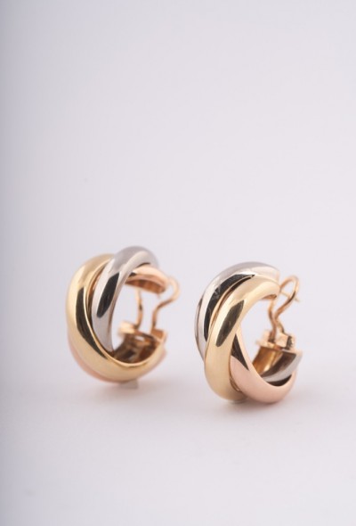 Gouden trinity oorstekers van Cartier