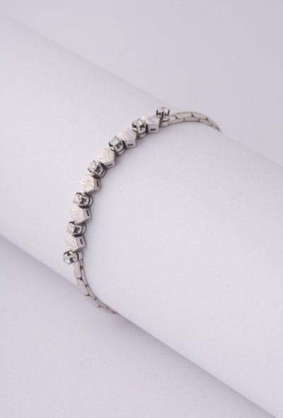 Wit gouden armband met 7 briljanten