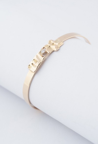 Gouden bangle met een briljant met Meesterteken P. vd Hout