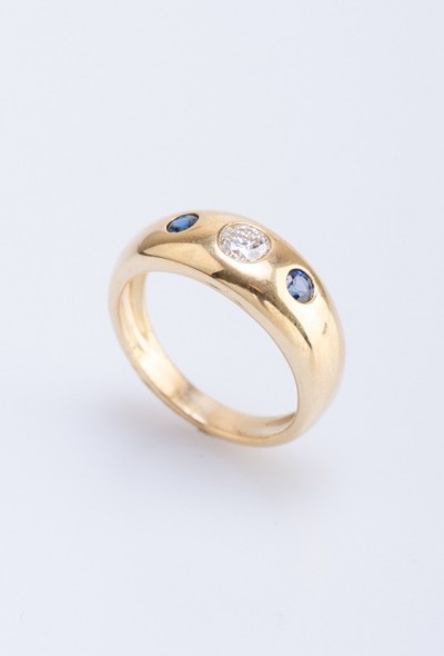 Gouden band ring met een briljant en saffieren