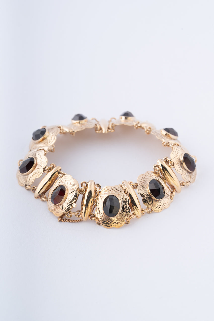 Gouden schakel armband met granaten