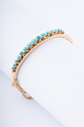 Gouden bangle met turkooisen