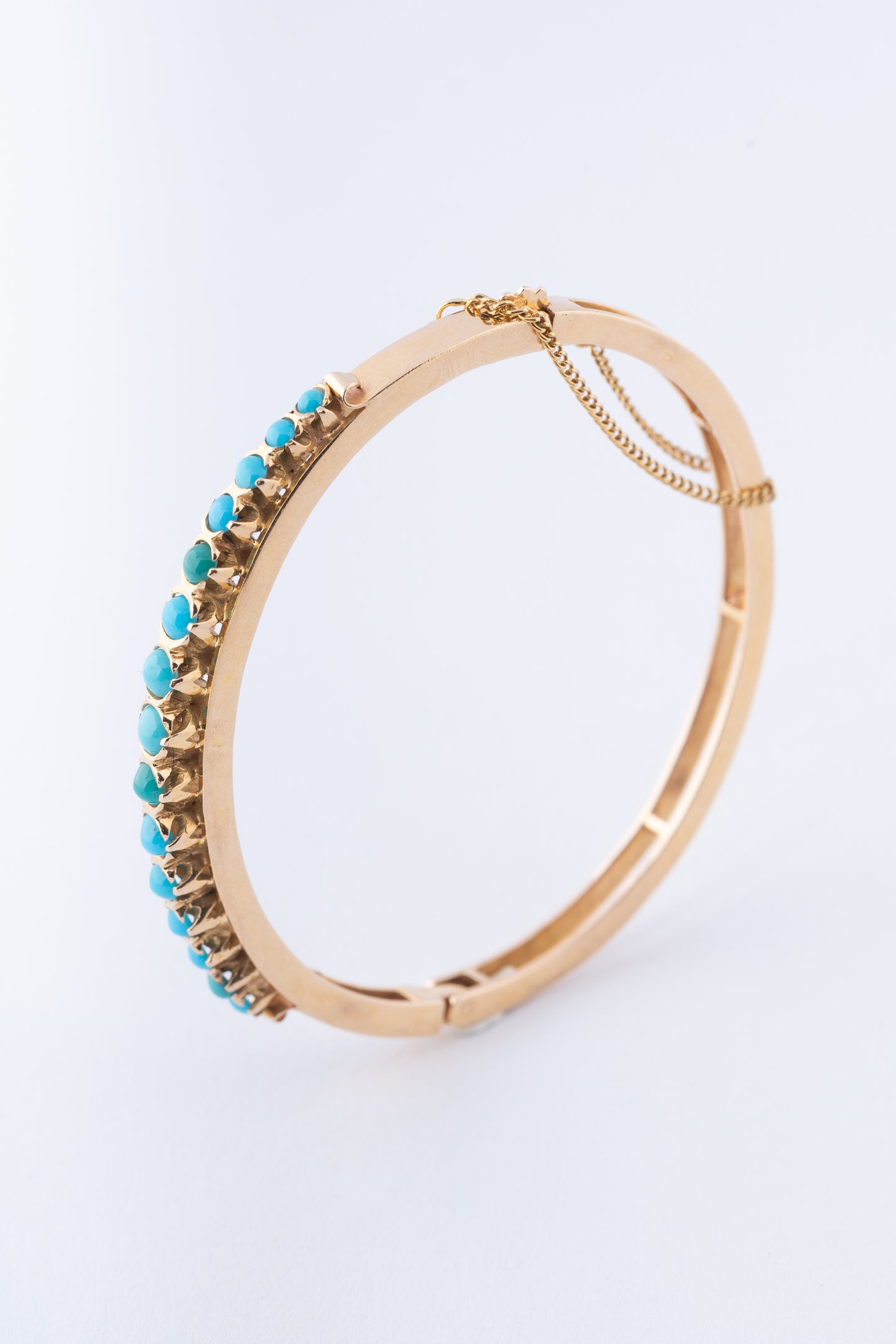 Gouden bangle met turkooisen