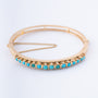 Gouden bangle met turkooisen