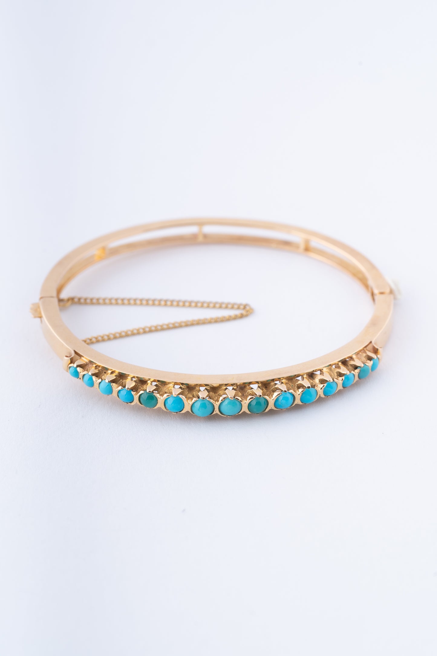 Gouden bangle met turkooisen