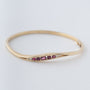 Geel gouden bangle met robijnen en briljanten