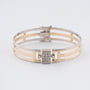 Wit/geelgouden spangen bangle met briljanten en scharniersluiting