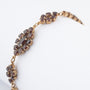 Geelgouden schakelarmband met granaten