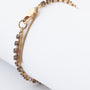 Geelgouden schakelarmband met granaten
