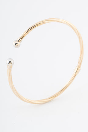 Geelgouden klem bangle met veer