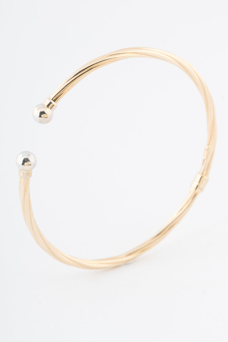 Geelgouden klem bangle met veer