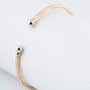Geelgouden klem bangle met veer