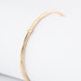 Geelgouden klem bangle met veer