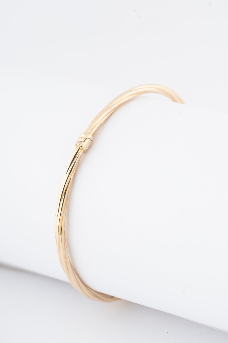 Geelgouden klem bangle met veer