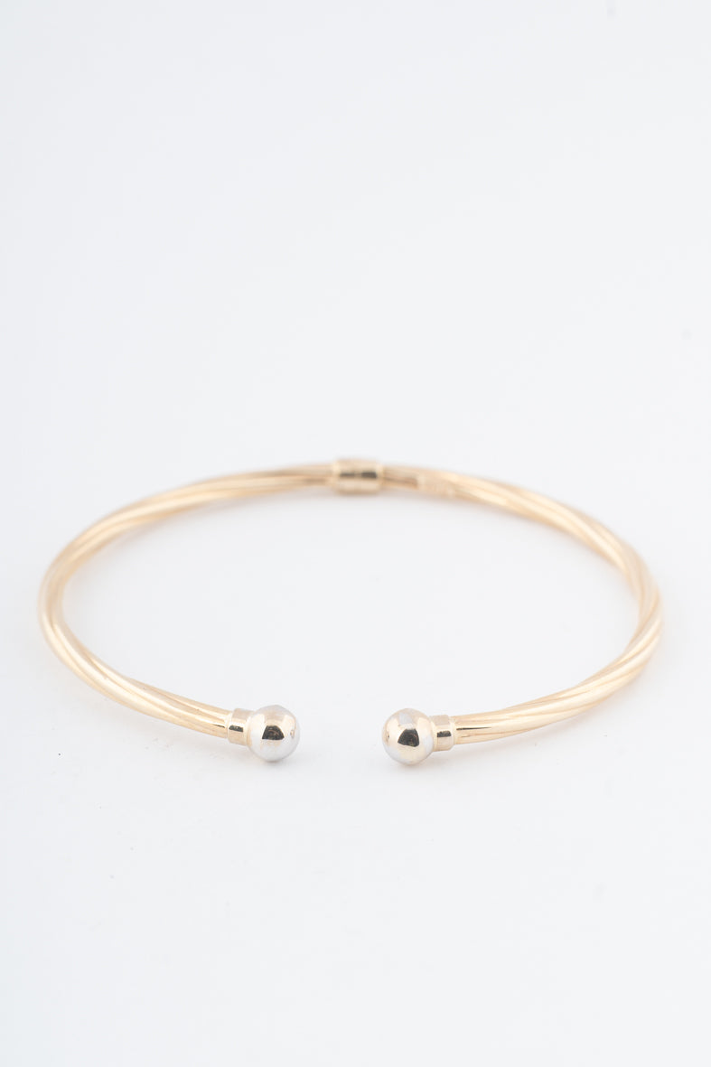 Geelgouden klem bangle met veer