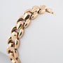 Yellow gold link bracelet with safety chain