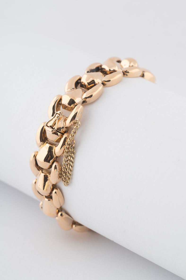 Yellow gold link bracelet with safety chain