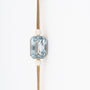 Oude geelgouden brochette met een blauwe spinel en parels
