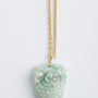 Jade hanger met gouden oog aan gouden anker collier