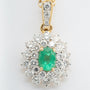 Yellow gold double cluster pendant with emerald and brilliant cut diamonds on a yellow gold necklace