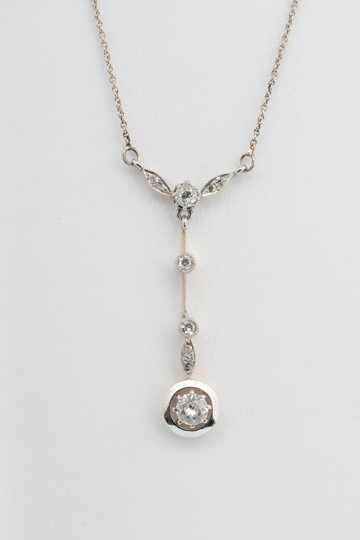 Antique white/yellow gold pendant with brilliant and rose-cut diamonds on a white gold necklace