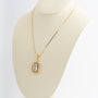 Yellow gold pendant with aquamarine on a yellow gold necklace