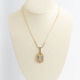 Yellow gold pendant with aquamarine on a yellow gold necklace