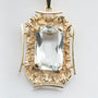 Yellow gold pendant with aquamarine on a yellow gold necklace