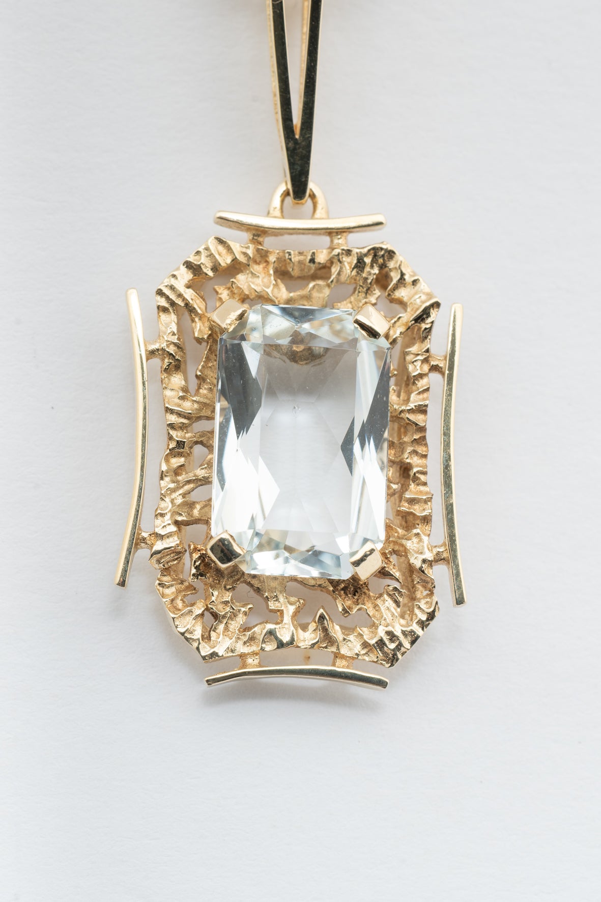 Yellow gold pendant with aquamarine on a yellow gold necklace
