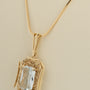 Yellow gold pendant with aquamarine on a yellow gold necklace