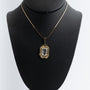 Yellow gold pendant with aquamarine on a yellow gold necklace