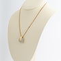 White/yellow gold pendant with brilliant-cut diamonds on a yellow gold gourmet chain
