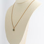 Yellow gold entourage pendant with emerald and diamonds on yellow gold gourmet necklace