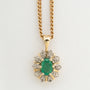 Yellow gold entourage pendant with emerald and diamonds on yellow gold gourmet necklace