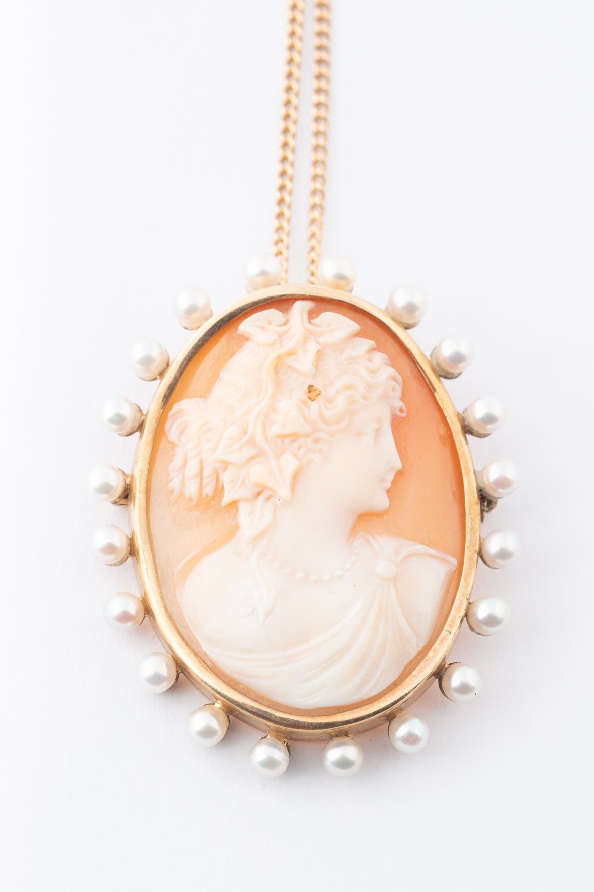 Antique yellow gold cameo/brooch pendant on a yellow gold necklace