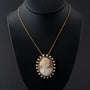 Antique yellow gold cameo/brooch pendant on a yellow gold necklace