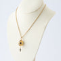 Yellow gold egg with brilliants on a yellow gold anchor chain, Fabergé