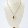 Yellow gold egg with brilliants on a yellow gold anchor chain, Fabergé