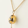 Yellow gold egg with brilliants on a yellow gold anchor chain, Fabergé
