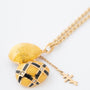Yellow gold egg with brilliants on a yellow gold anchor chain, Fabergé