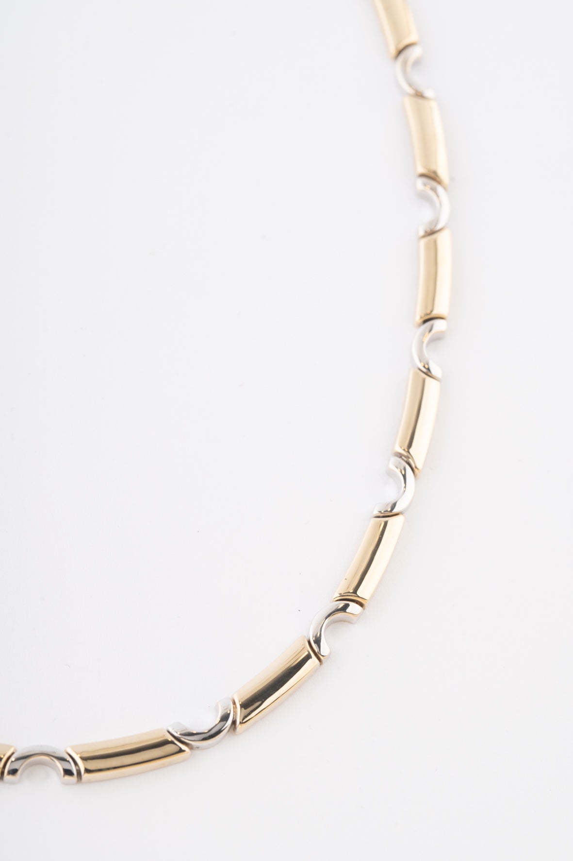 Witgouden/geelgouden schakel collier