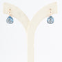Roségouden oorhangers met briljant en blauw kristal