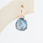 Roségouden oorhangers met briljant en blauw kristal