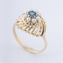 Gouden entourage ring met blauwe topaas en parels