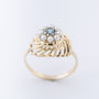Gouden entourage ring met blauwe topaas en parels