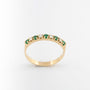 Yellow gold eternity ring with emeralds and brilliant cut diamonds