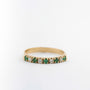 Yellow gold eternity ring with emeralds and brilliant cut diamonds