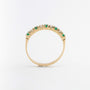 Yellow gold eternity ring with emeralds and brilliant cut diamonds