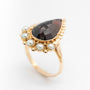 Yellow gold ring with pear-shaped garnet and pearls