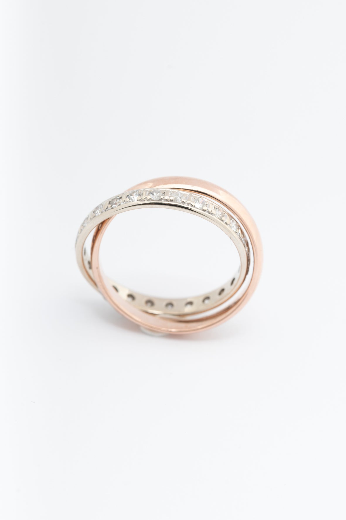 Bi-color gold ring, the white gold part being an eternity ring with diamonds (rose gold white gold)
